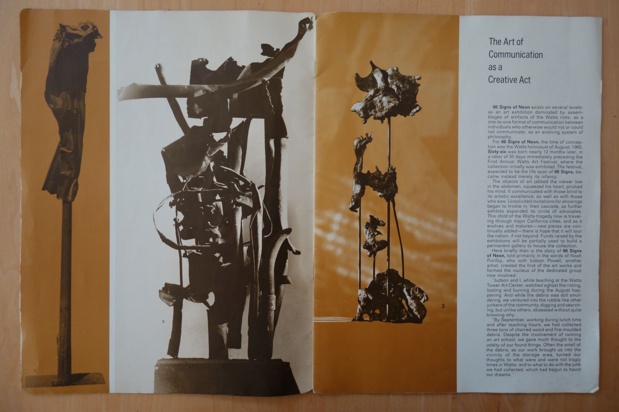 Page from a catalog of the exhibition '66 Signs of Neon', showing 3 assemblage sculptures made from detritus of the Watts riots, and text describing the origins of the exhibit.