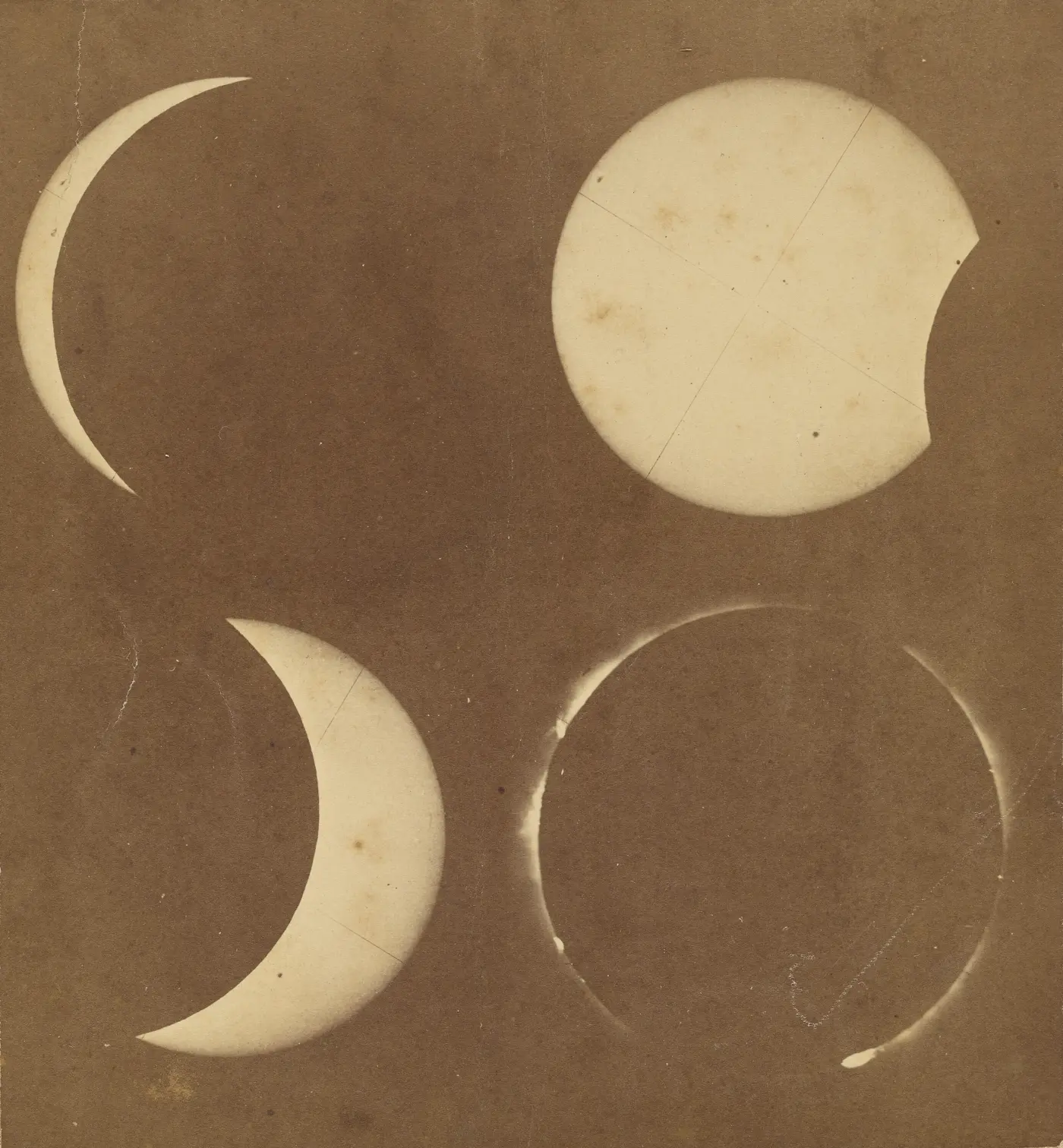 An old sepia-toned print of a solar eclipse at four stages, arranged in two rows