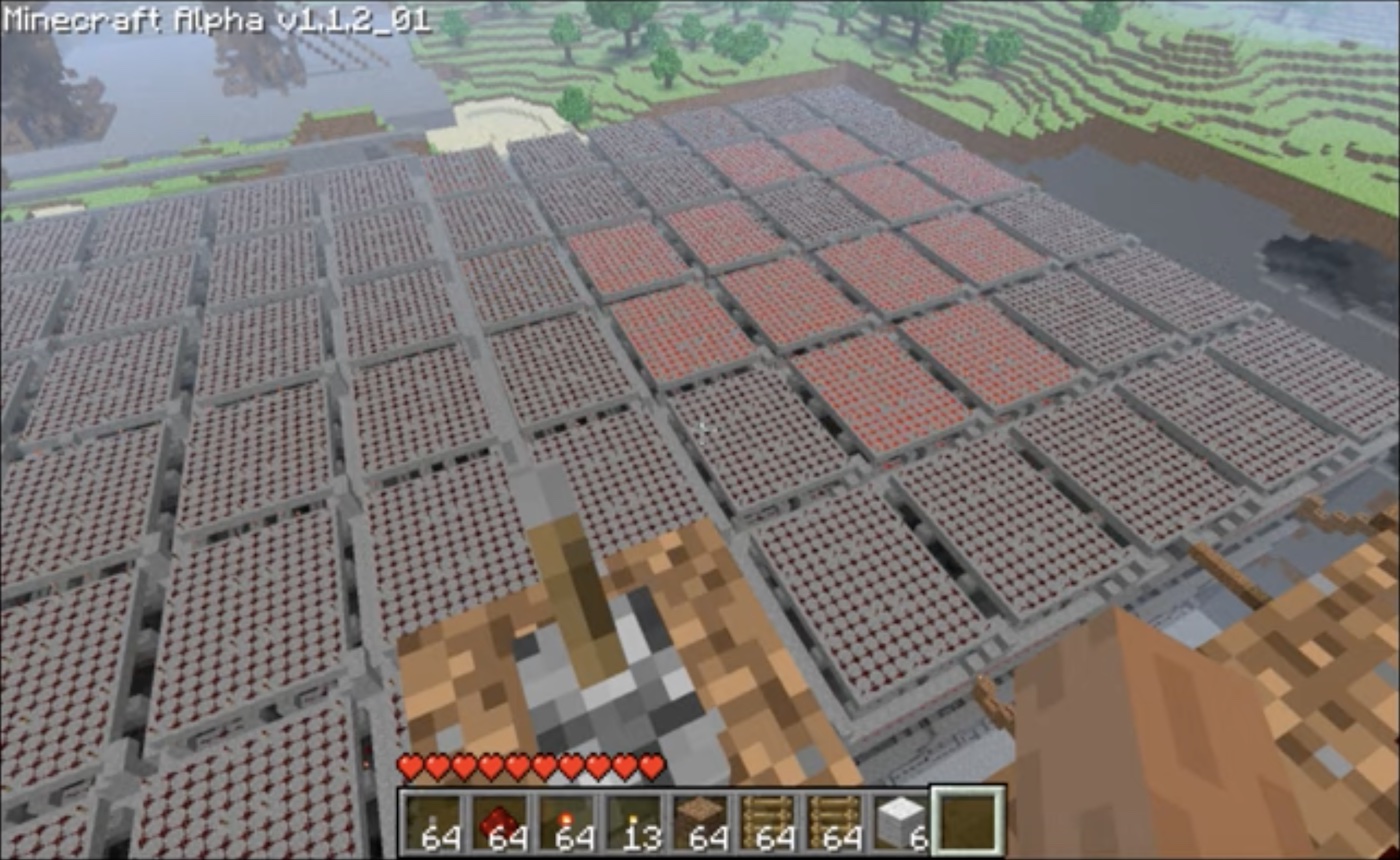 Screenshot of the game Minecraft, in which a player has built a redstone computer that runs Conway's Game of 
      Life simulation. The simulation is displayed on a large screen in the game, with a grid of cells that are either 
      alive or dead.